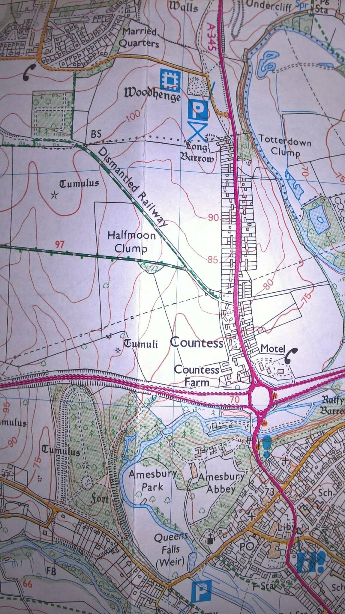 Auto-generated description: A detailed map displays roads, railways, and landmarks such as Woodhenge, Amesbury Abbey, and a disused railway near Countess Farm.